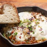 3 Eggs In Hell · Zucchini, burrata cheese, and spinach mixed in a spicy tomato sauce, served with sourdough b...