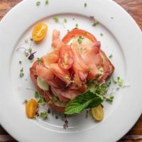 Smoked Salmon · Toasted Balthazar multigrain bread served with cream cheese, smoked salmon, tomatoes, cucumb...