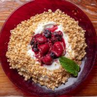 Granola And Yogurt · Roasted house made granola with poached berries on a bed of Greek yogurt