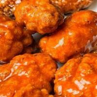 Boneless Wings · crisp and juicy all white meat chicken ordered with a KC Red (mild), Buffalo (medium), Nashv...