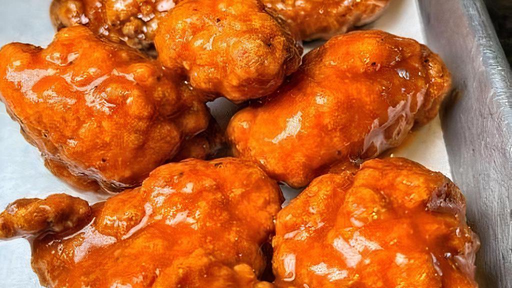 Boneless Wings · crisp and juicy all white meat chicken ordered with a KC Red (mild), Buffalo (medium), Nashville Hot (medium), Korean BBQ (medium) or mango habanero (very hot) coating - served with our Alabama white dipping sauce and prepared gluten free.