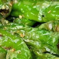 Shishito Peppers · blistered shishito peppers, smoked citrus salt, lemon juice served with Alabama White dippin...