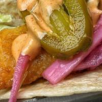 Baja Fish Taco · crisp battered cod, shredded lettuce, pickled onions, jalapeños, spicy mayo on a flour or co...