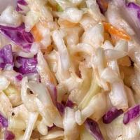 Coleslaw · shredded green cabbage, purple cabbage and carrots seasoned with a mayo-based dressing