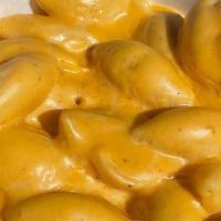 Mac N' Cheez · our mac n' cheez is made with pasta shells and a blend of 5 different cheese