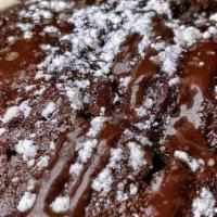 Chocolate Lava Cake · warm chocolate ganache surrounded by delectable chocolate cake - served with vanilla bean ic...