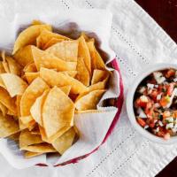 Pico & Chips · Combination of tomato, cilantro and onions in lime juice and salt with tortilla chips on side.