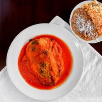 Chile Relleno · Poblano pepper stuffed with either chicken, steak or cheese in ranchero sauce.