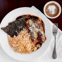 Enchiladas Y Carne Asada · Two chicken mole enchiladas, skirt steak and small mixed salad. Served with rice and beans.