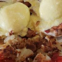 Eggs Benedict · Two Poached Eggs on a Toasted English Muffin with Canadian Bacon & Hollandaise Sauce, served...