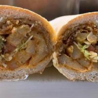 Gyro Sandwich · Cooked on a spit and wrapped in a pita.