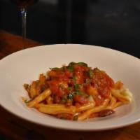 Lady Of The Night · house-made fresh fusilli pasta with plum tomato sauce, Italian black Gaeta & green Castelvet...