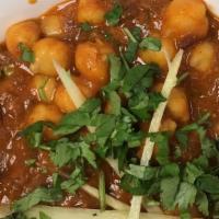 Chana Masala · Chickpeas cooked in aromatic onions, tomato and spice sauce.