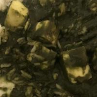 Palak Paneer · Spinach cooked in onions, tomatoes, fenugreek and homemade cheese.