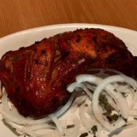 Chicken Tandoori · Roasted chicken marinated in yogurt, lemon juice and spices.
