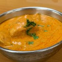 Chicken Tikka Masala · Boneless chicken cooked special butter, yogurt, tomato sauce and garnished with green chilies.