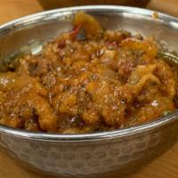 Chicken Chili (Sweet And Sour) · Boneless chicken cooked with fresh ground spices sauteed with tomato, bell peppers, sweet an...