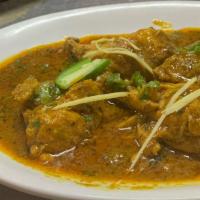 Chicken Karahi · Delicious Chicken cooked in a wok with fresh tomatoes, spices and green chilis.