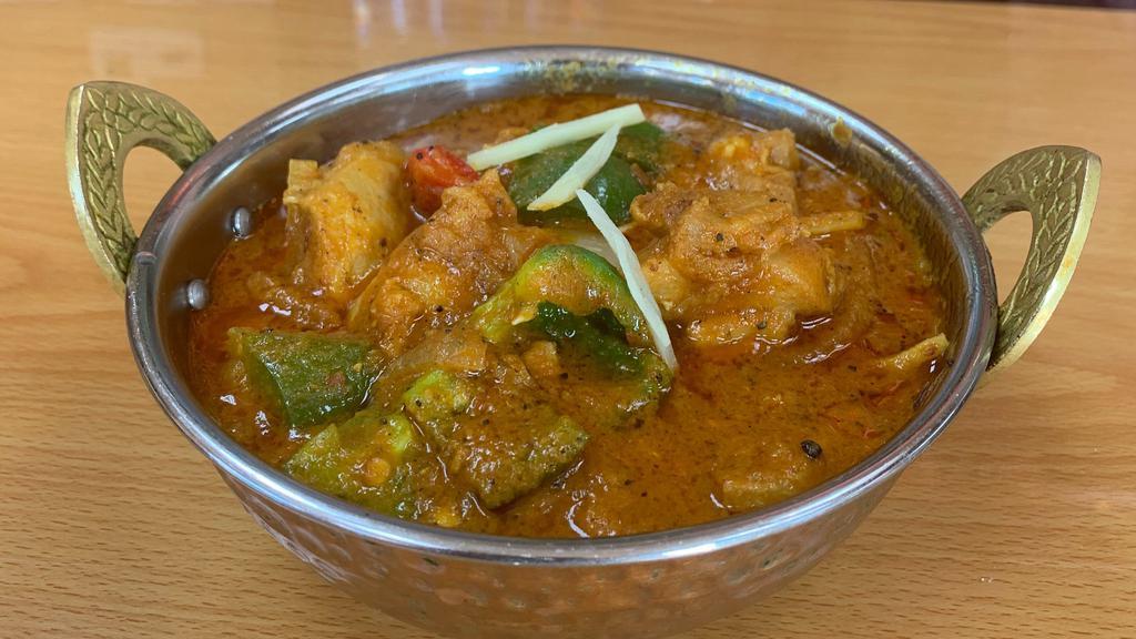 Chicken Jalfrezi · Boneless chicken cooked with fresh ground spices sauteed with tomato, bell peppers, onion, ginger and coriander, garnished with green chilies.
