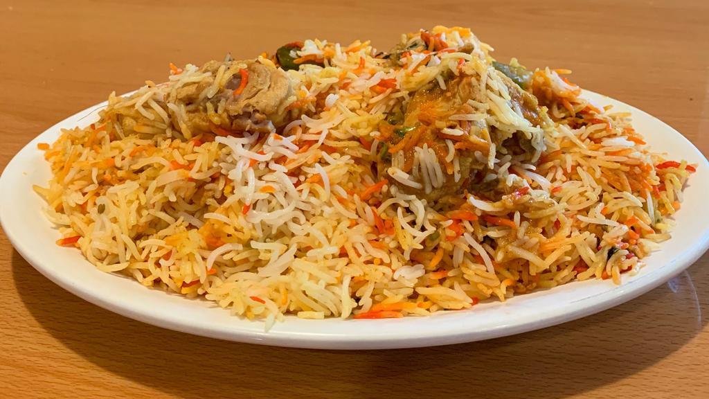 Chicken Biryani · Spiced chicken cooked in herbs and spices with basmati rice.