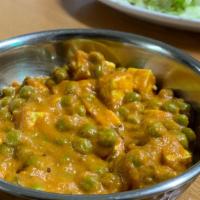 Matar Paneer · Green peas and Paneer pieces cooked with onions  and spices with tomatoes.
