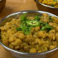 Chana Masala · Chickpeas boiled then cooked with chopped onion, chopped tomatoes, turmeric powder, cumin an...