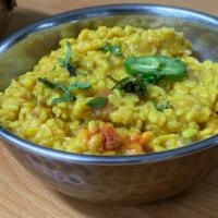 Dal Mash · White lentils cooked with herbs and spices.