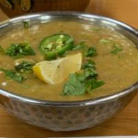Goat Haleem · Wheat, lentils and meat (minced goat) slow cooked with spices and herb.