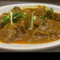Goat Karahi  · Delicious goat cooked in a wok with fresh tomatoes, red and green chili.