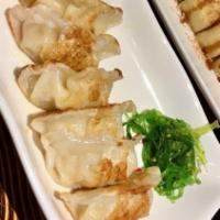 Shrimp Gyoza · Pan fried shrimp dumplings six pieces.