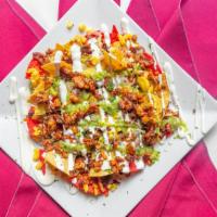 Nachos · Crispy corn tortilla spread with refried beans and melted cheese. Topped with the choice of ...