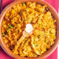 Arroz Con Pollo · Chunks of chicken breast with olives, onions, tomatoes and cilantro, simmered in casserole w...