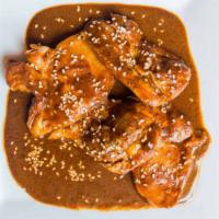 Mole Poblano · Boneless chicken breast stewed in our homemade mole poblano sauce.