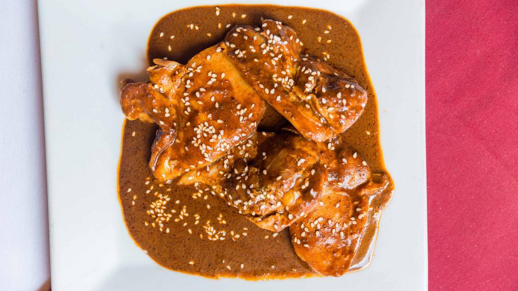 Mole Poblano · Boneless chicken breast stewed in our homemade mole poblano sauce.