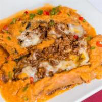 Chiles Rellenos · Roasted poblano peppers dipped in egg butter, pan fried and stuffed with your choice of fill...