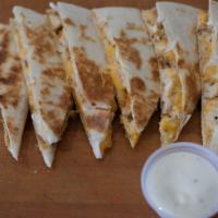 Cheesy Chicken Quesadilla · A blend of Monterey Jack and cheddar cheese with grilled chicken. Add steak for an additiona...