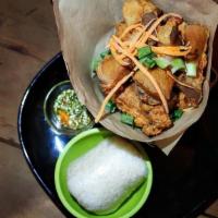 Jurassic Pork · fried flavorful pork belly with a side of crushed garlic spicy lime juice dipping sauce & a ...