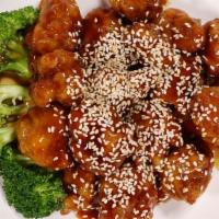 Sesame Chicken · Served with rice.