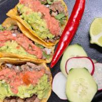 Tacos · Fresh hand made tortilla with cilantro, onions, guacamole, salsa and your choice of meat
