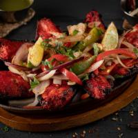 Tandoori Chicken Wings · delicious  grilled dish of wings marinated and cooked with spices.