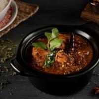 Chicken Curry · Cubes of chicken cooked in ginger with traditional Indian curry.