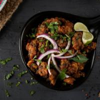 Chicken Pepper Fry · Pieces of chicken (with bone) cooked in a traditional South Indian style with ground black p...
