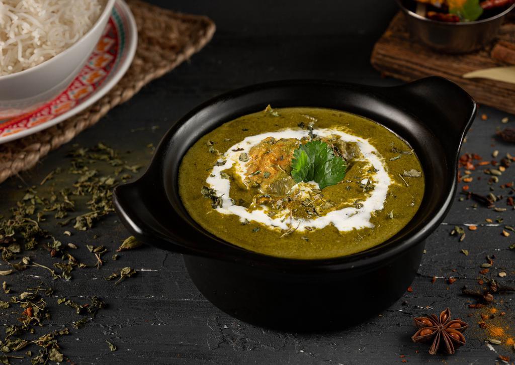 Chicken Saag · Cubes of chicken and cream of spinach cooked with spices.