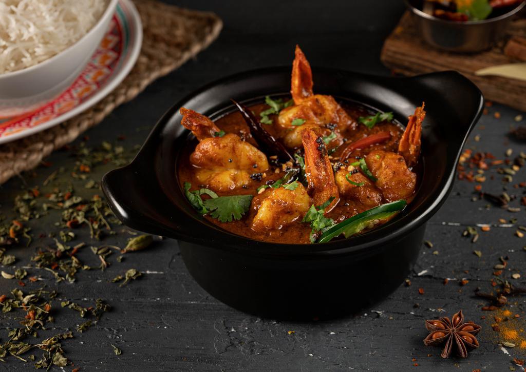 Shrimp Curry · Shrimp cooked in onion and tomato sauce with traditional Indian curry.