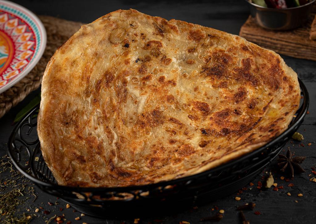 Aloo Paratha · loo paratha is unleavened dough stuffed with a mixture of mashed potato and spices, which is rolled out and cooked on a hot tawa with butter or ghee.