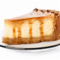 Creamy Caramel Cake · Creamy cream cheese filled cake mixed with caramel and vanilla frosting.
