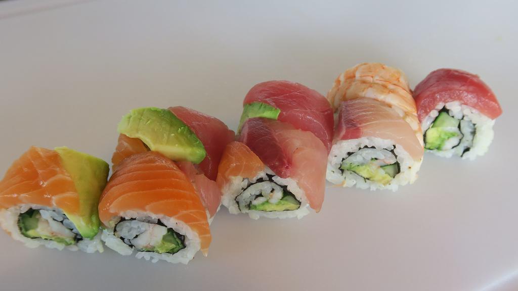 Rainbow · Ahi (tuna), salmon, hamachi (yellowtail), avocado, shrimp, shrimp California roll (shrimp, avocado, cucumber, mayonnaise, nori (seaweed)), sesame seeds.