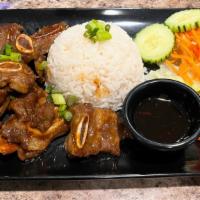 D1 House Special Short Rib · Grilled marinated ribs with house special sauce, serve with Rice, lettuce, and tomato.