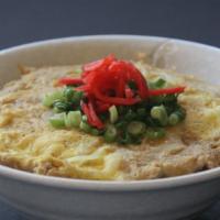 Katsu Don · Rice bowl topped with simmered chicken or pork cutlet, egg and onion. Topped with scallion a...