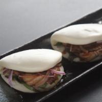 Buns · Pork, shrimp tempura or kani salad served with vegetable and sauce inside steamed soft bread.